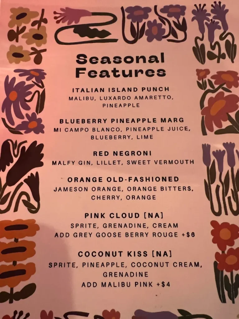 Menu featuring a list of seasonal cocktails and non-alcoholic options.